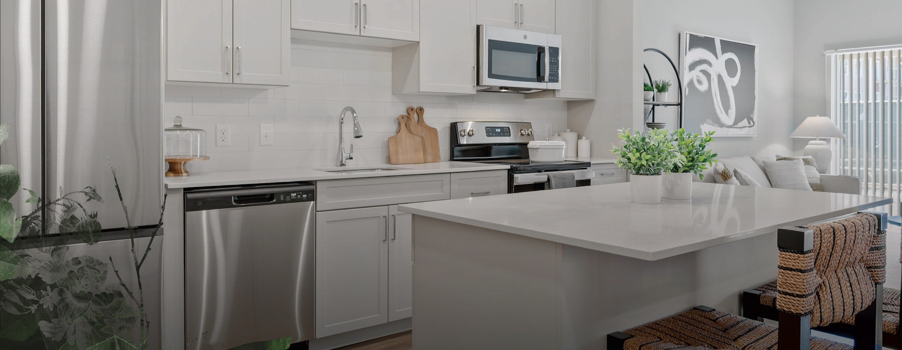 Model kitchen at Millyard at Meadows Commons apartments in Newington, CT, featuring stainless steel appliances.